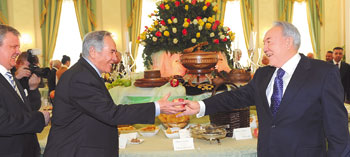 President Nazarbayev (right) hands apples and other goodies to foreign ambassadors at a reception following his traditional meeting with the diplomatic corps, which now includes 65 heads of missions in Astana and one in Almaty. 1358988904