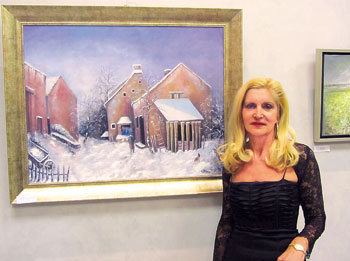 Martine Rivasi-Offant poses in front of one of her creations. 1361324195