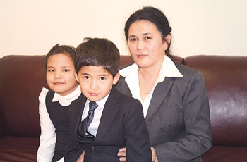 Gulshat Ismailova believes she and her husband earn enough money not only to raise two of their children, Aigerim and Daulet, but also to have a third child. 1364491094