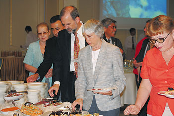 Distinguished guests such as U.S. Ambassador Kenneth Fairfax (c) and his spouse Nyetta Yarkin (to his left) had a chance to try fish cooking masterpieces prepared by the Norwegian chef at the Radisson Hotel. 1372259037