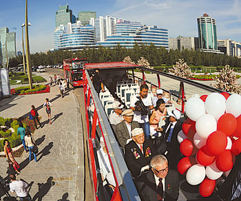 Passengers can hop on and off the new tourist buses to explore the sights of Astana. 1378915128